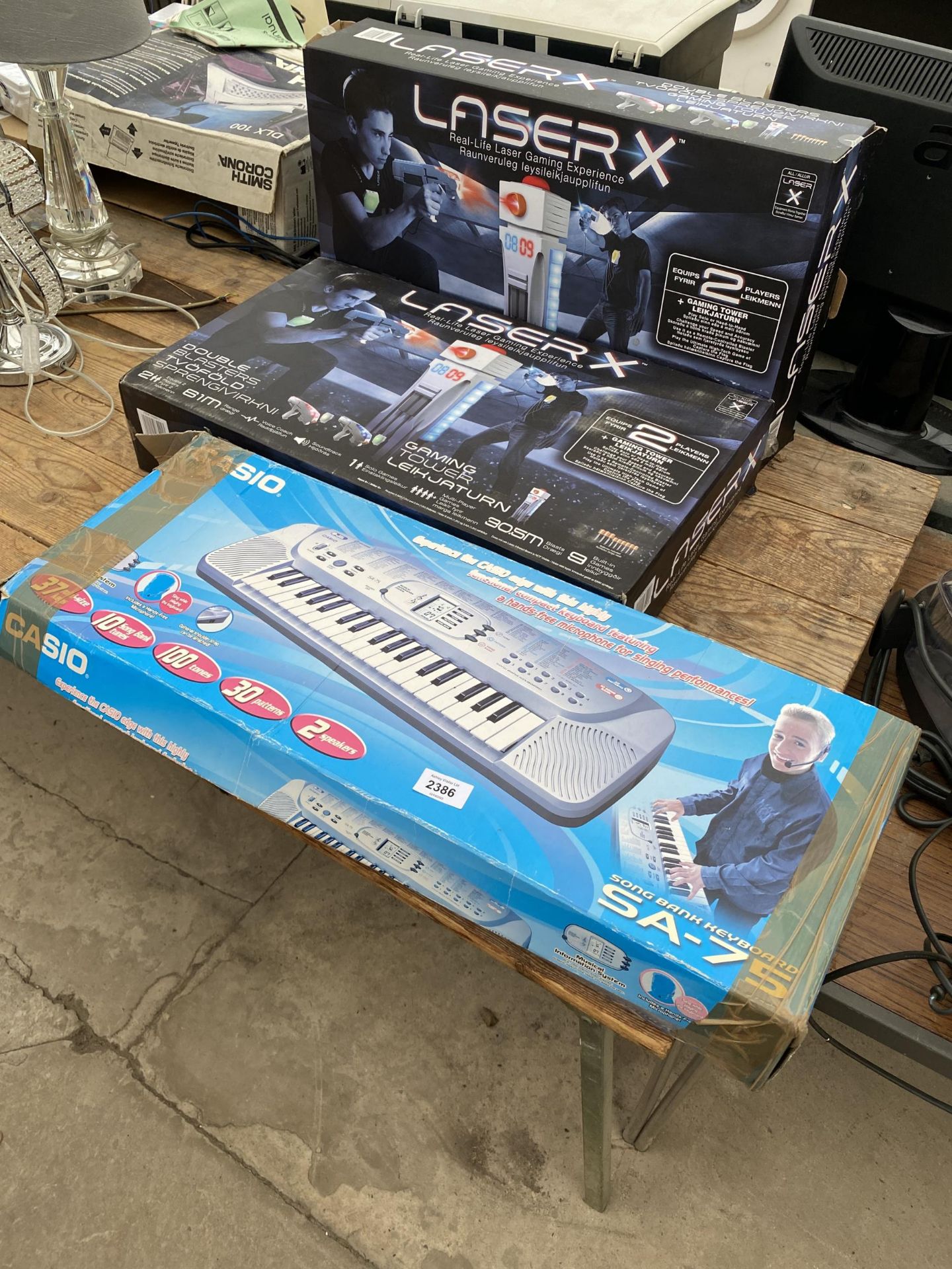 A CASIO KEYBOARD AND TWO LASERX GAMES