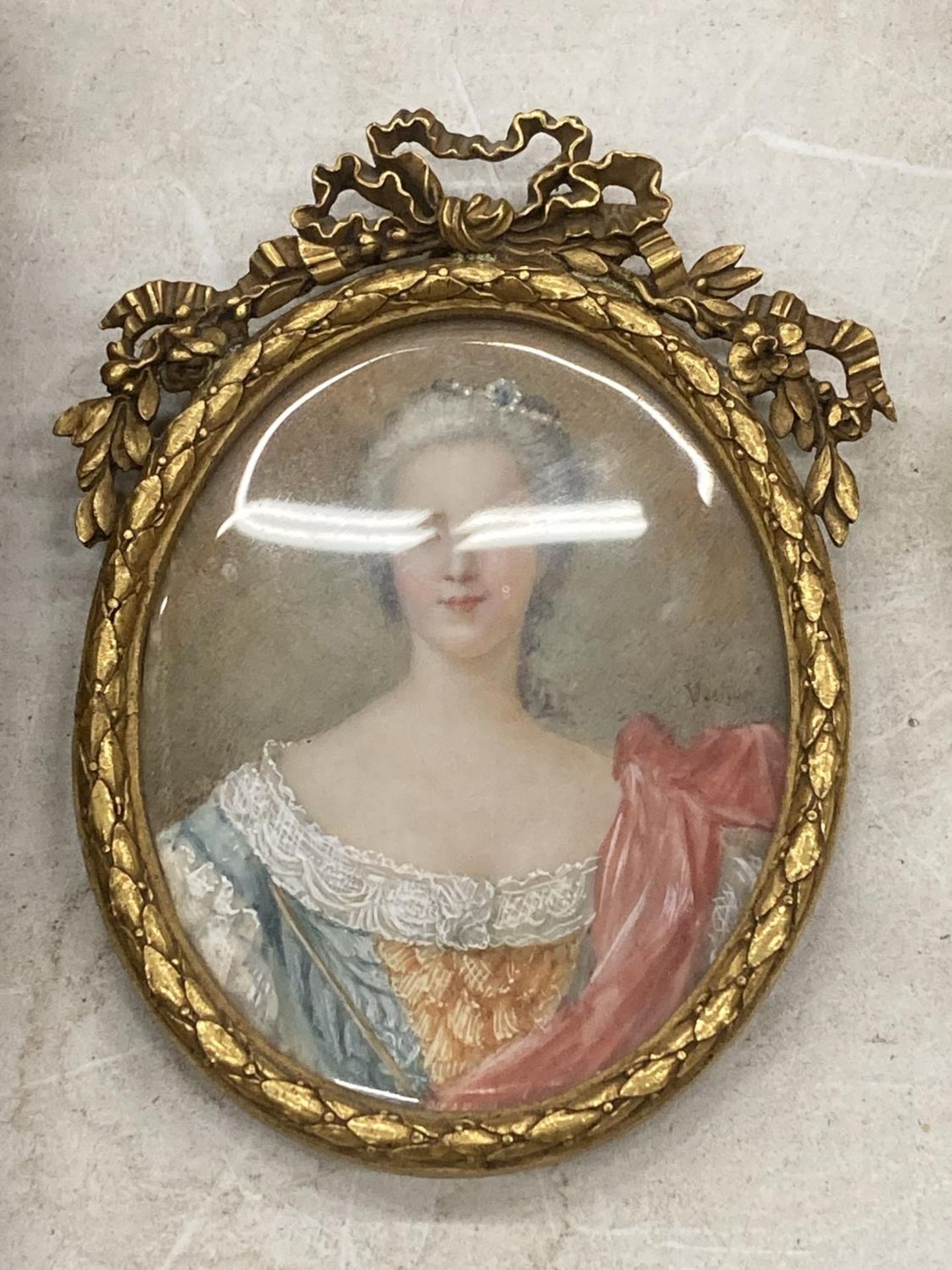 A 19TH CENTURY HAND PAINTED PORTRAIT OF A LADY, INDISTINCTLY SIGNED, IN GILT RIBBON FRAME, LENGTH