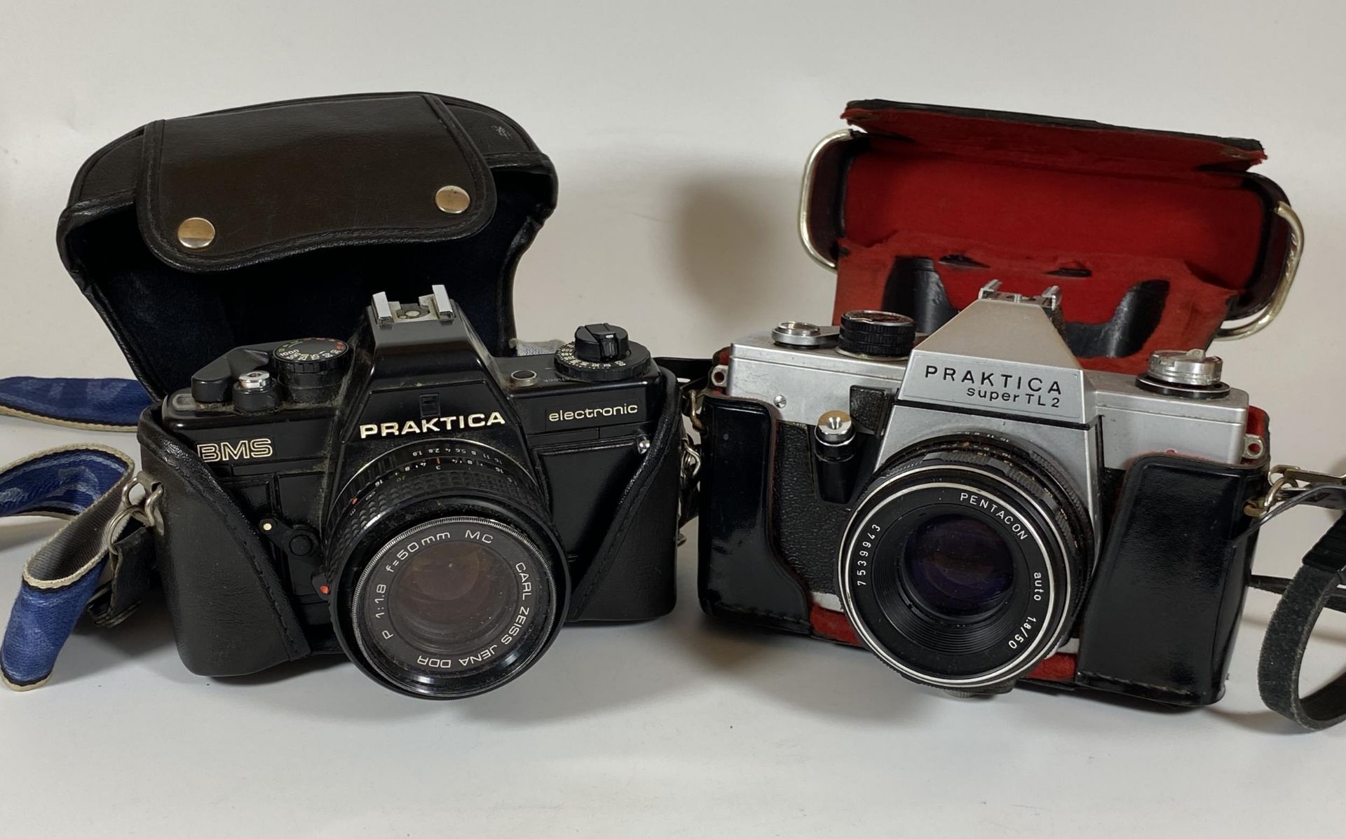 TWO VINTAGE CASED PRAKTICA CAMERAS - PRAKTICA BMS ELECTRONIC FITTED WITH CARL ZEISS JENA DDR 50MM,