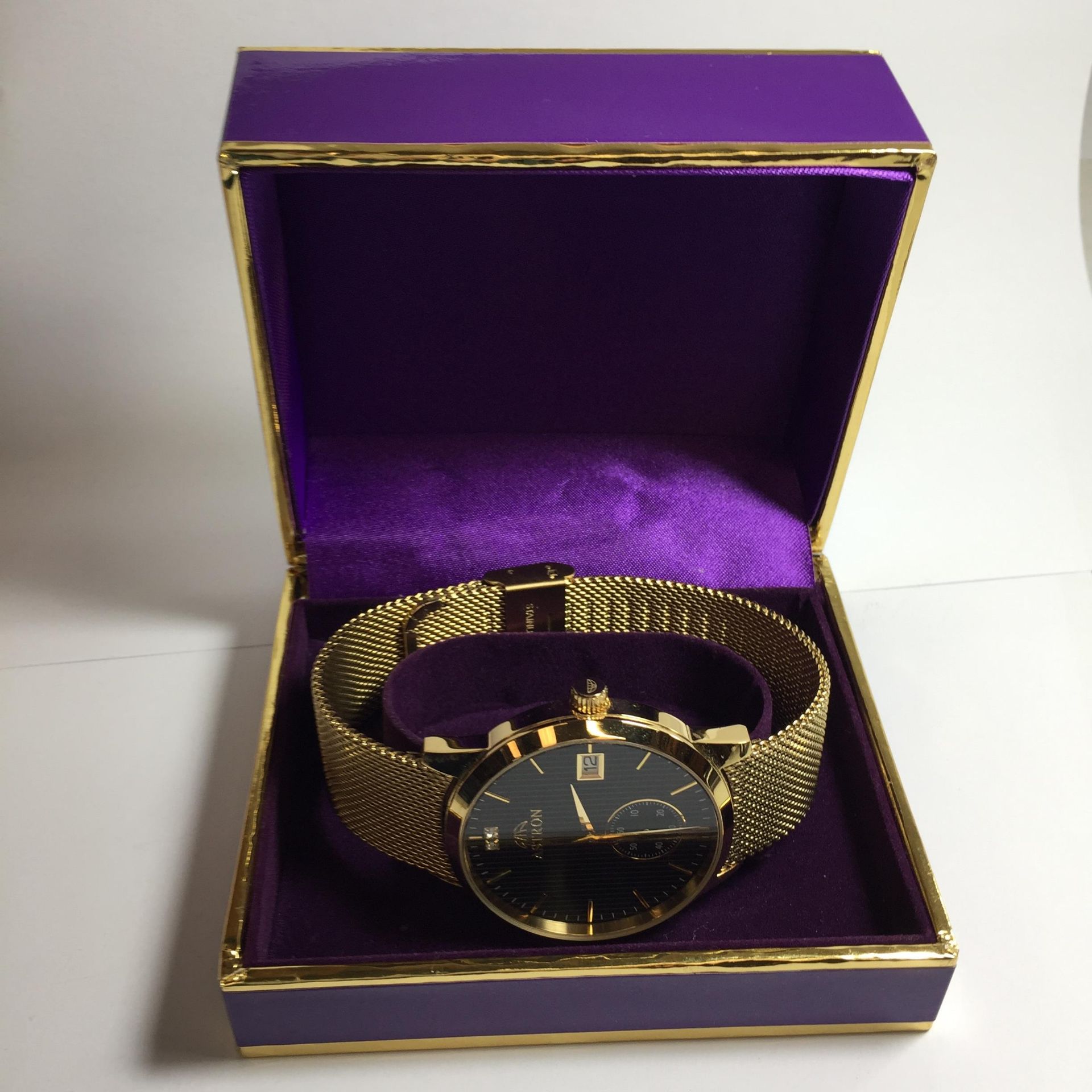 AN ASTRON RONDO GOLD PLATED WATCH WITH CRYSTALS