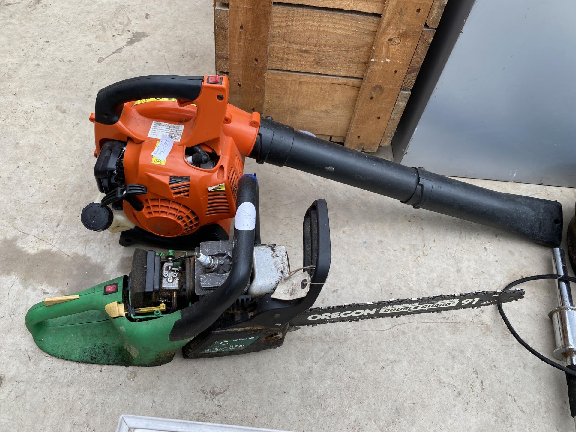 A GARDENLINE PETROL CHAINSAW AND A PETROL LEAF BLOWER