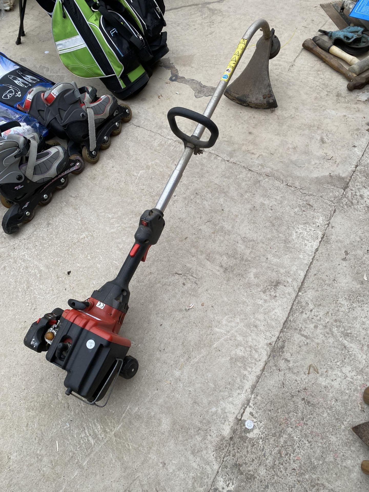 A LAWN KING PETROL GRASS STRIMMER