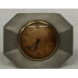 AN ART DECO HALLMARKED SILVER CLOCK WITH ENGINE TURNED DESIGN