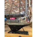 A VINTAGE STYLE METAL MODEL OF A YACHT WIDTH 46CM, HEIGHT 63CM