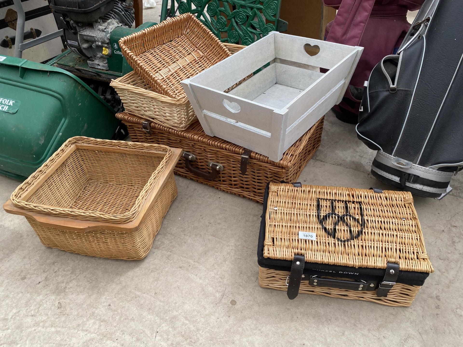 AN ASSORTMENT OF WICKER BASKETS AND A DECORATIVE WOODEN STORAGE TRAY