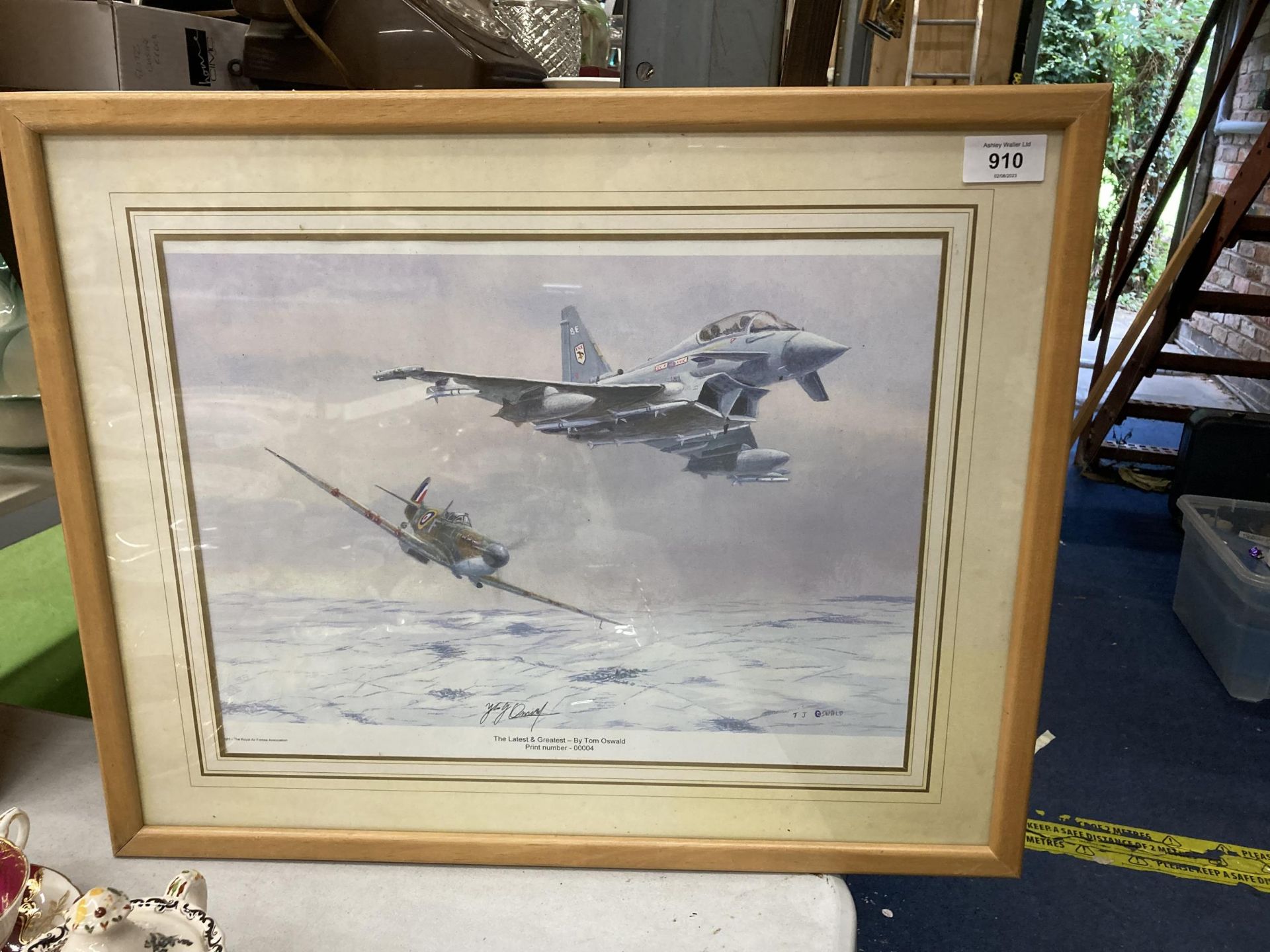 A FRAMED PENCIL SIGNED LIMITED EDITION PRINT OF A SPITFIRE - TITLED 'THE LATEST AND GREATEST' BY TOM