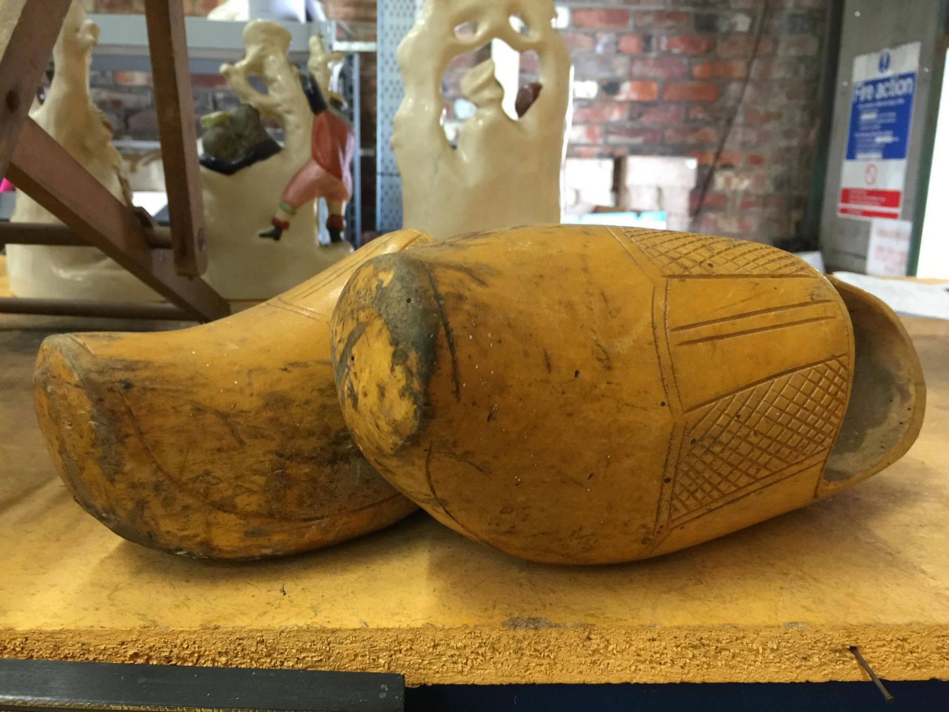 A LARGE PAIR OF VINTAGE WOODEN CLOGS