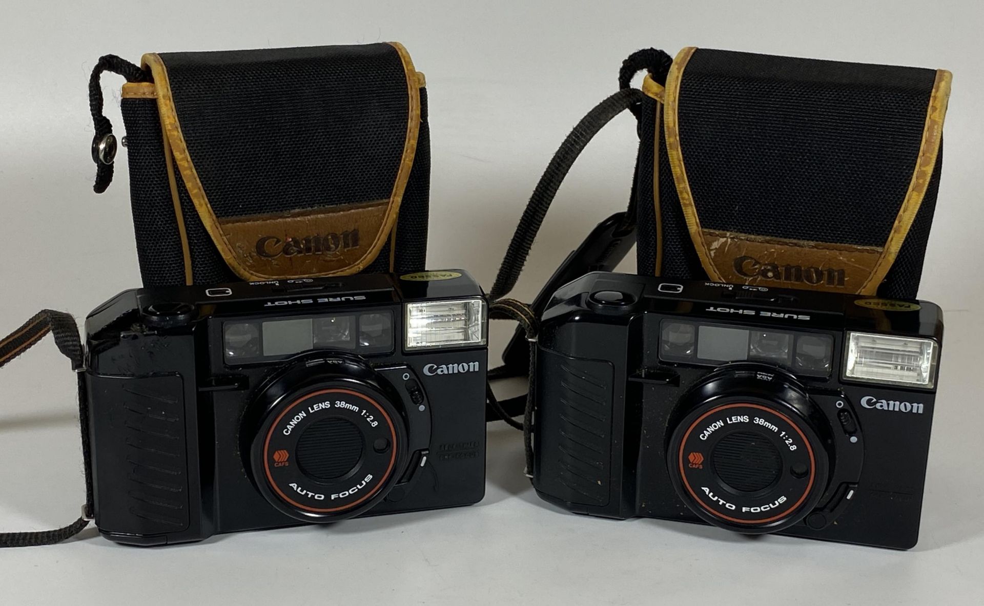 TWO CASED CANON SURE SHOT 38MM CAMERAS