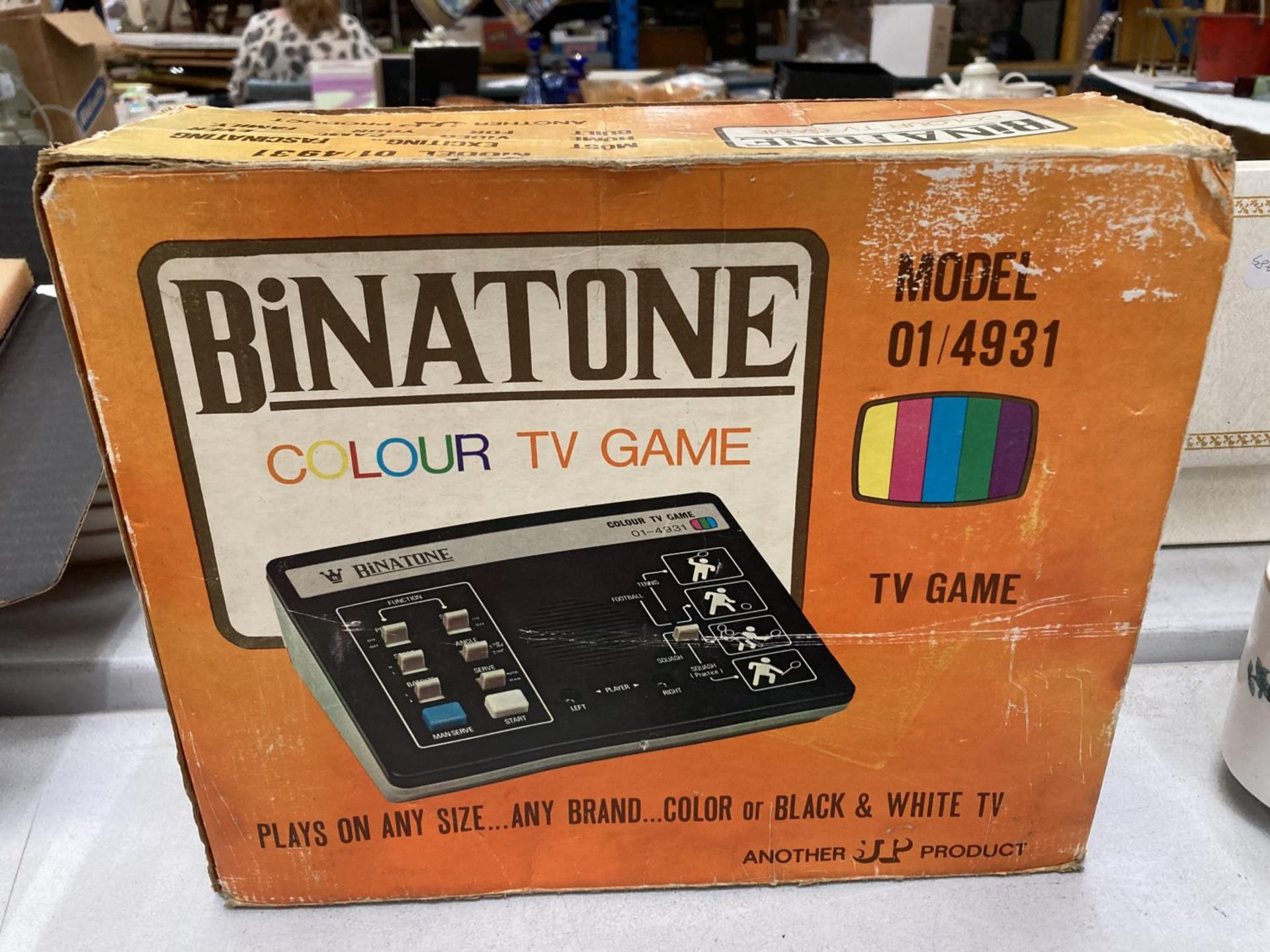 A VINTAGE BINATONE COLOUR TV GAME MODEL NO. 01/4931 IN ORIGINAL BOX