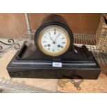 A DECORATRIVE POSSIBLY MARBEL MANTLE CLOCK WITH KEYS