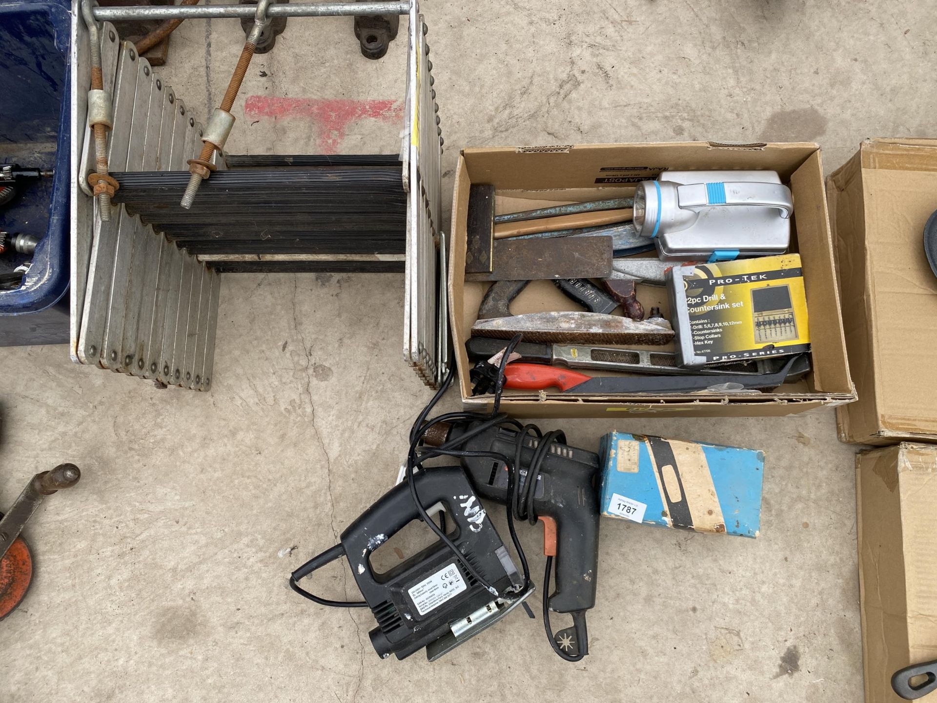 AN ASSORTMENT OF TOOLS TO INCLUDE AN ELECTRIC DRILL, AN ELECTRIC JIGSAW AND RASPS ETC
