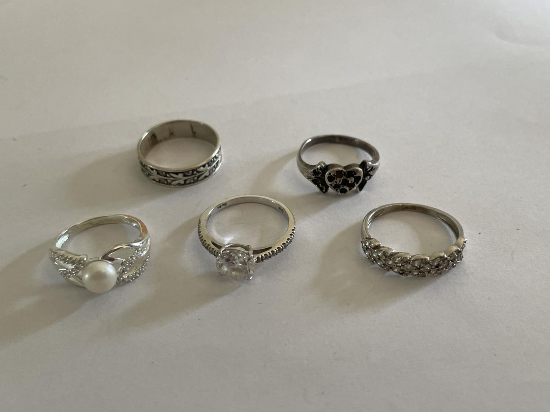 FIVE VARIOUS SILVER RINGS