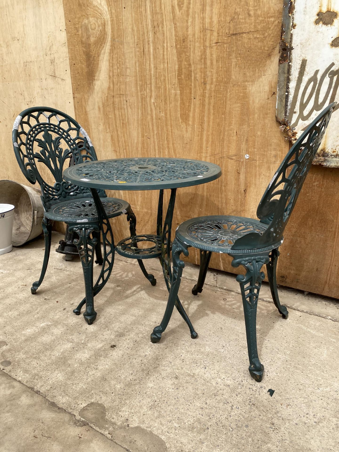 A VINTAGE CAST ALLOY BISTRO SET COMPRISING OF A ROUND TABLE AND TWO CHAIRS - Image 2 of 2