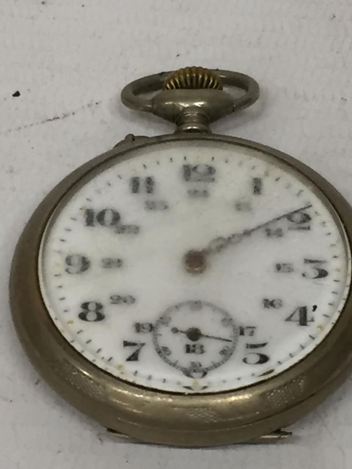 A VINTAGE WHITE METAL OPEN FACED POCKET WATCH, CASEBACK STAMPED ARGENTAN