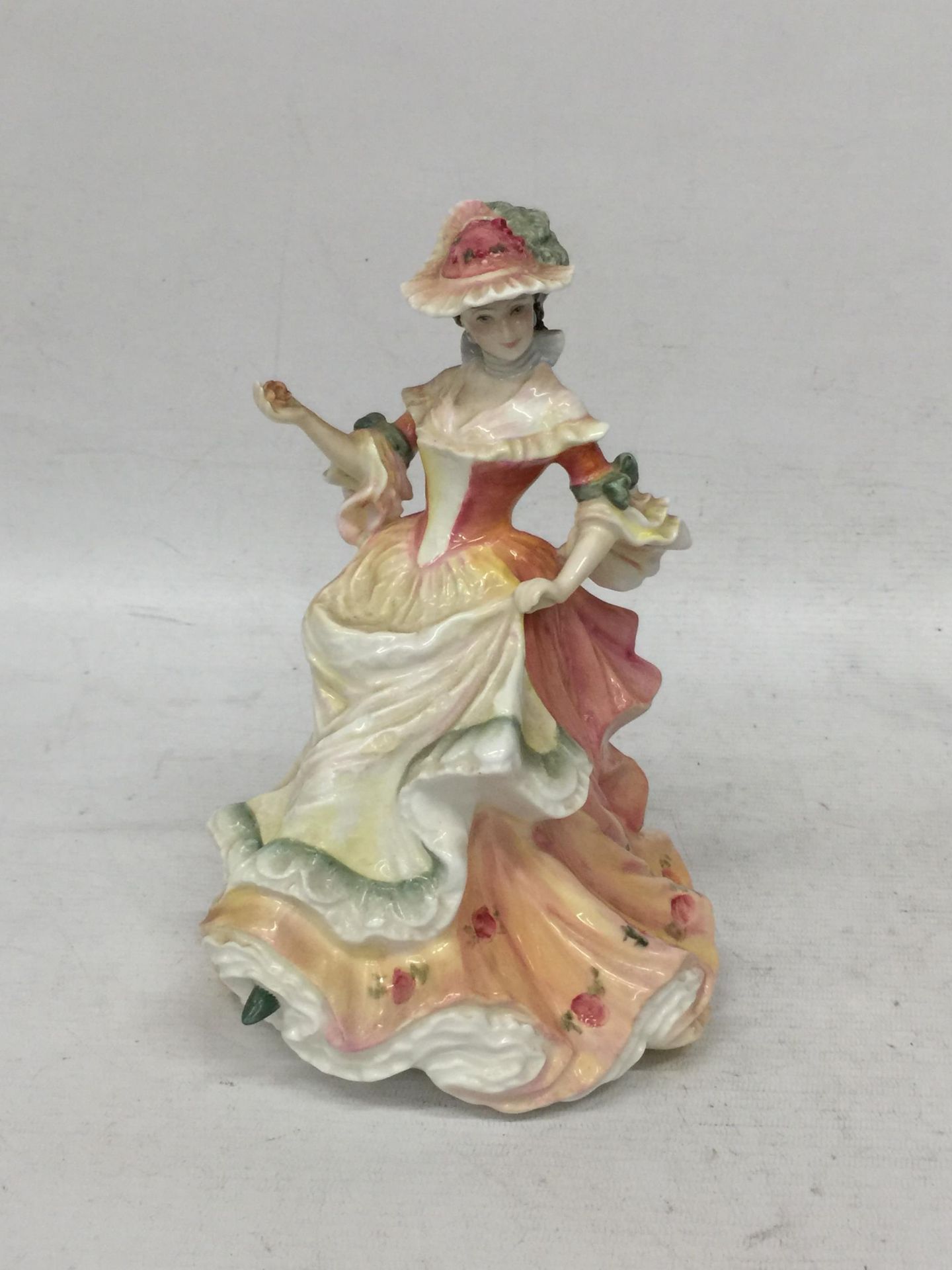A ROYAL DOULTON 'FLOWERS OF LOVE' ROSE HN3709 LADY FIGURE