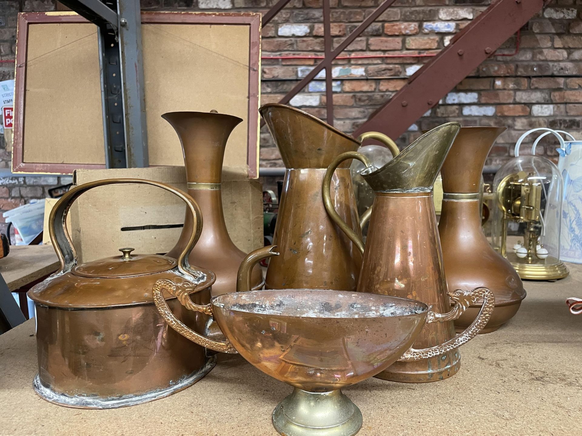 A COLLECTION OF COPPER JUGS, KETTLE AND TWIN HANDLED BOWL