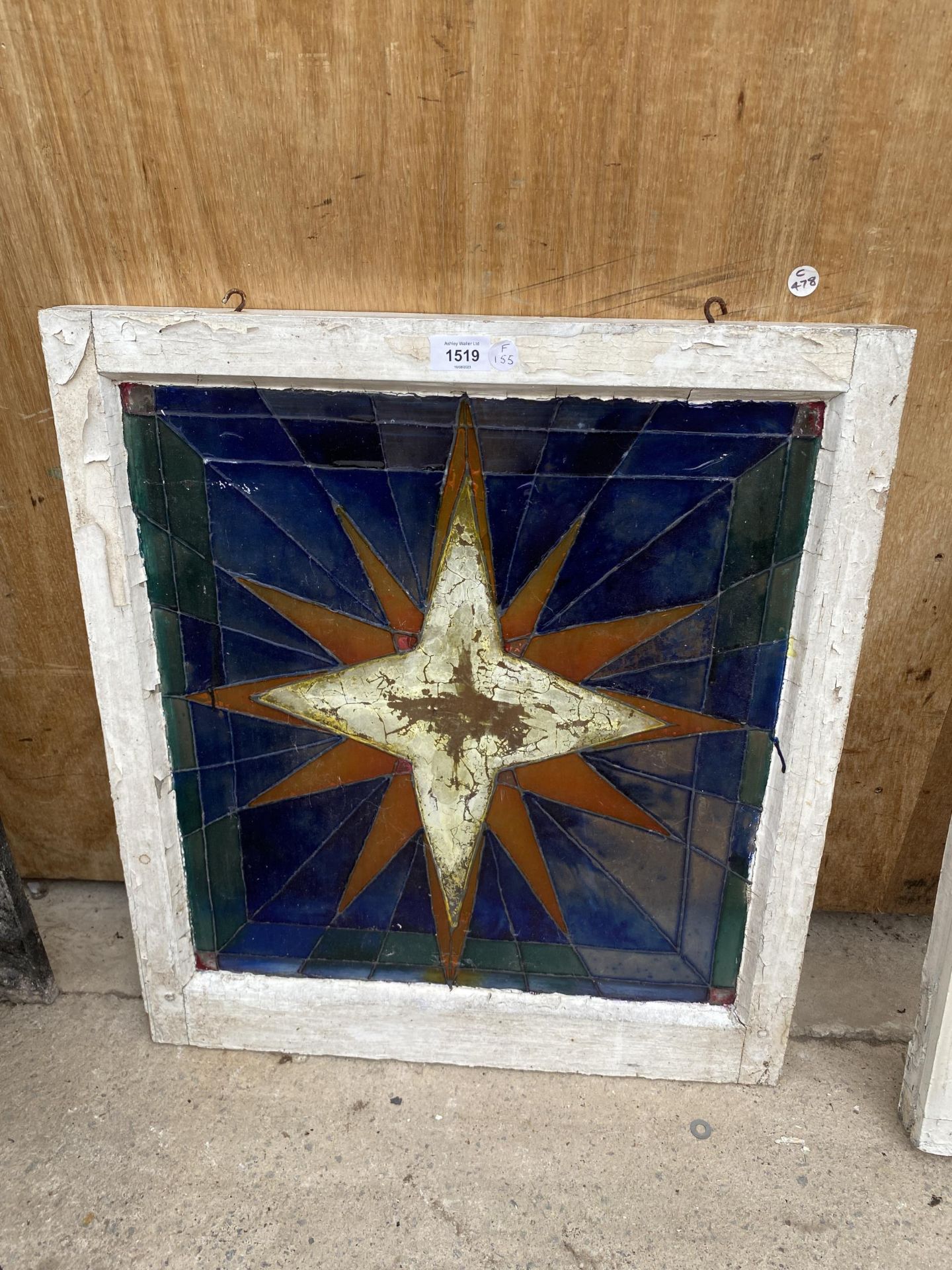 A VINTAGE LEADED GLASS STARBURST DESIGN WINDOW PANEL