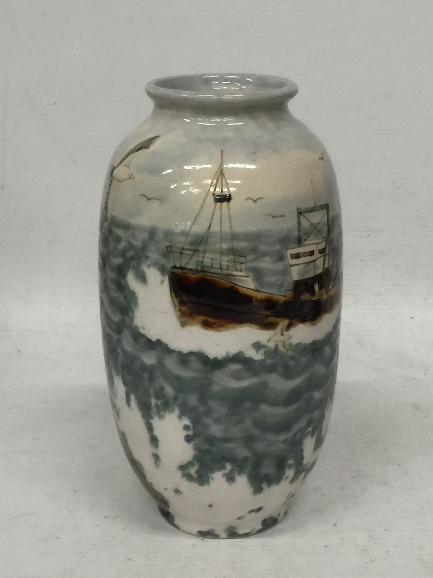 A COBRIDGE STONEWARE VASE WITH FISHING BOAT DESIGN