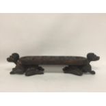 AN UNUSUAL TRIBAL WOODEN FIGURAL BALL STAND