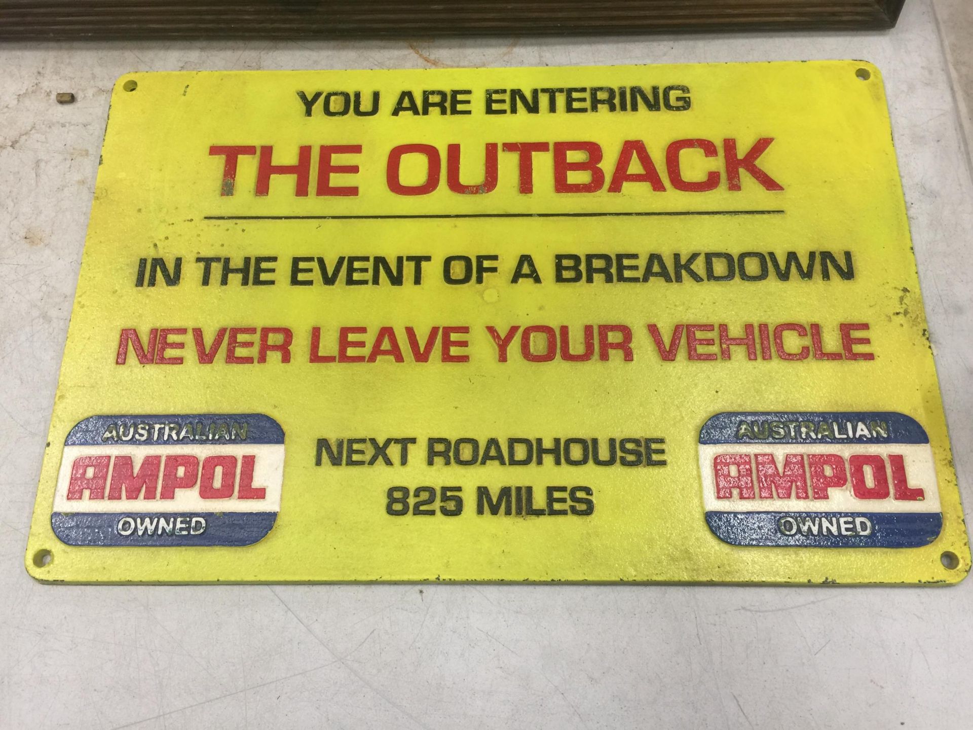 A LARGE CAST 'THE OUTBACK' SIGN