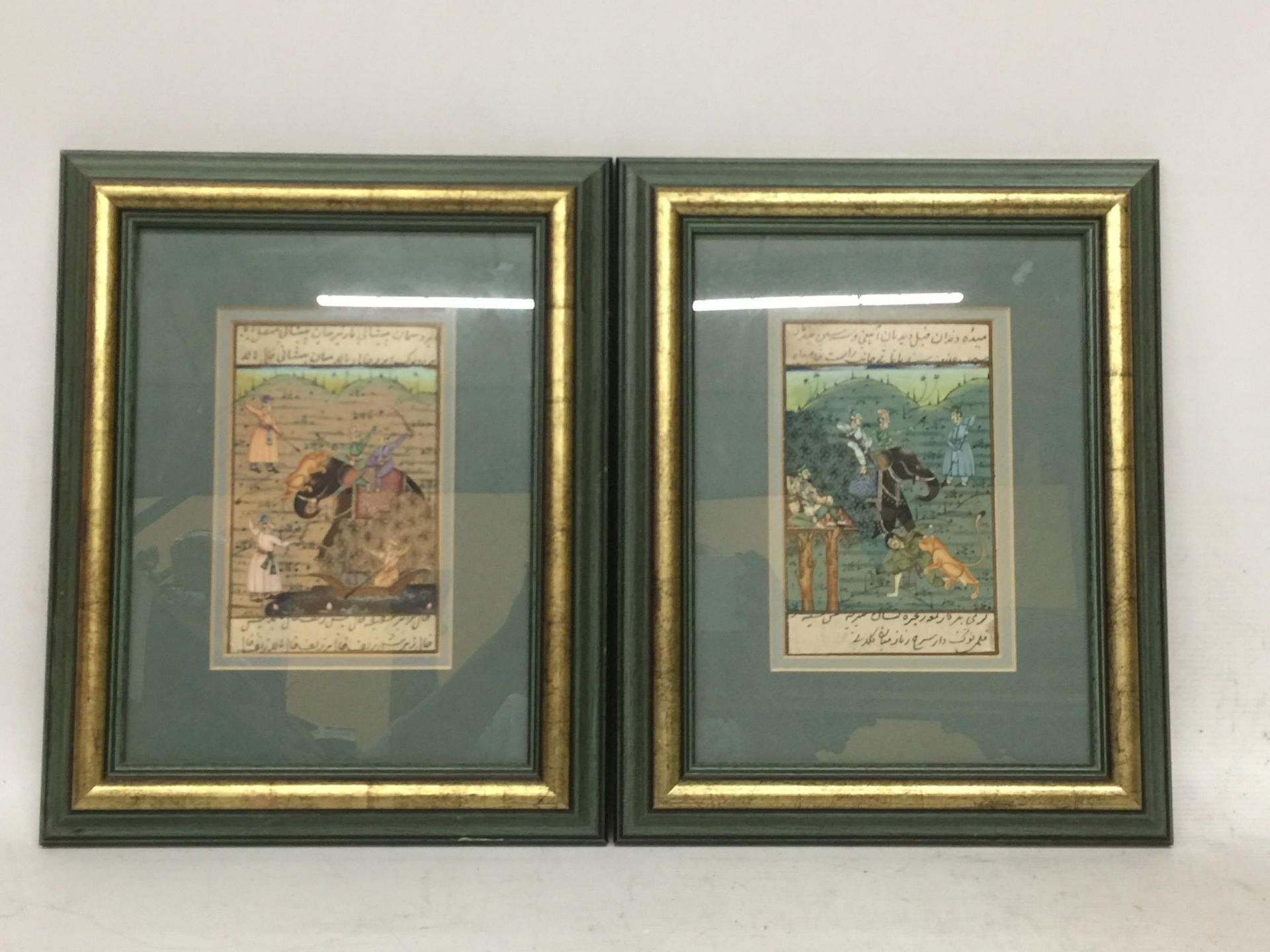 A PAIR OF FRAMED ORIENTAL SILK BATTLE SCENE PICTURES