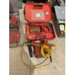 A HILTI T322 HAMMER DRILL AND DX NAIL GUN