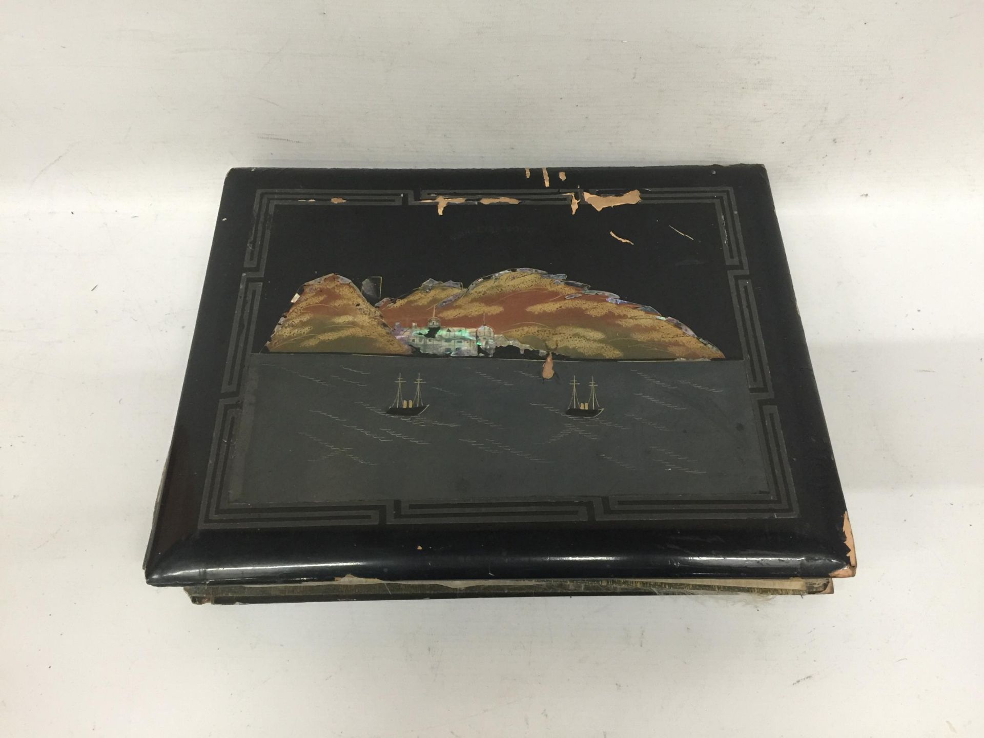 AN ORIENTAL LACQUERED DRAWING ALBUM WITH ASSORTED SKETCHES