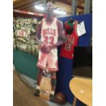 A MICHAEL JORDAN SPORTING LOT - SIGNED CUTOUT, CHICAGO BULLS JERSEY, NIKE HAT AND GOLD NBA