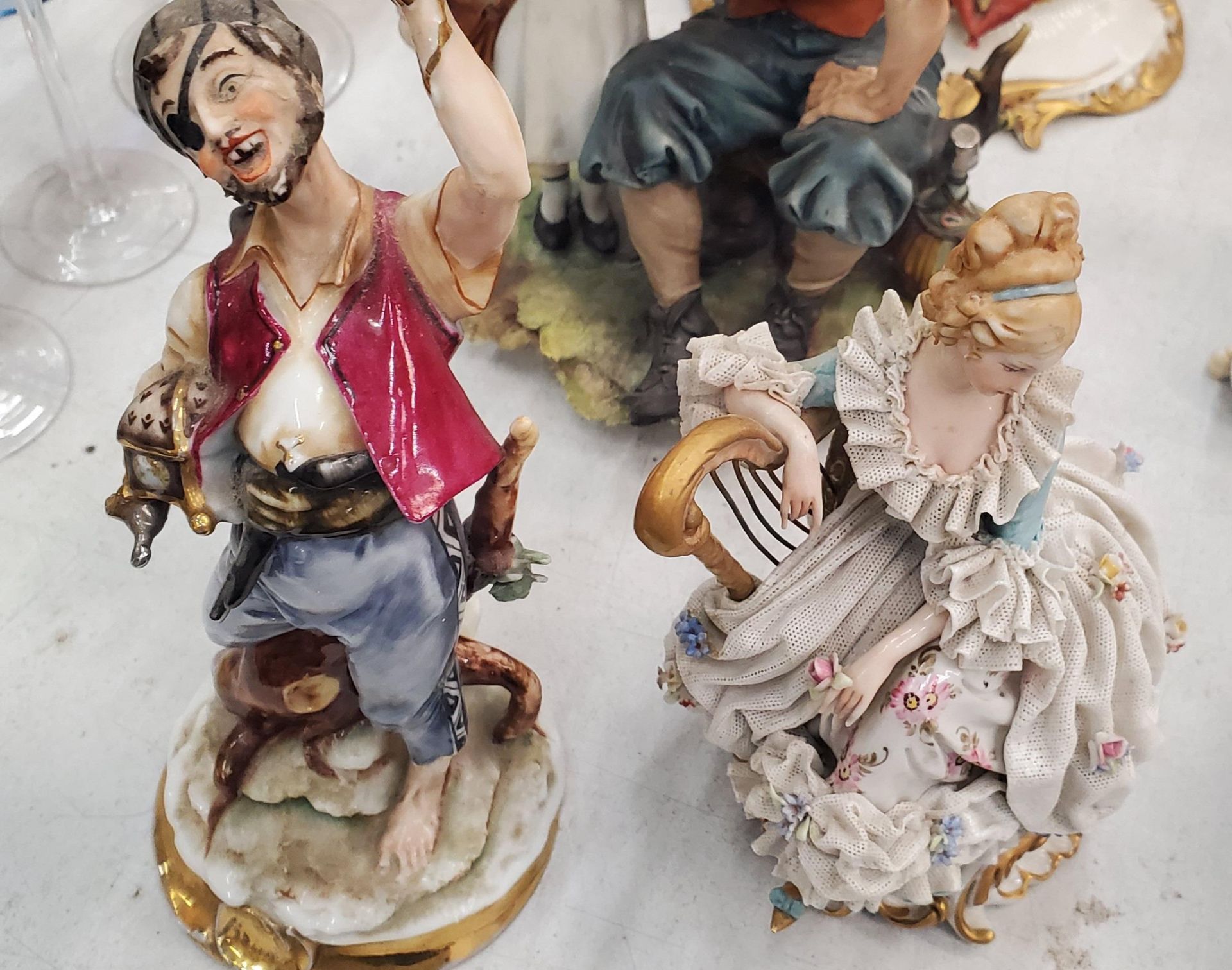 FIVE FIGURES TO INCLUDE THE DRUNKEN TRAMP ON A BENCH, A CAPODIMONTE FIGURE OF A LADY PLAYING A - Image 5 of 5