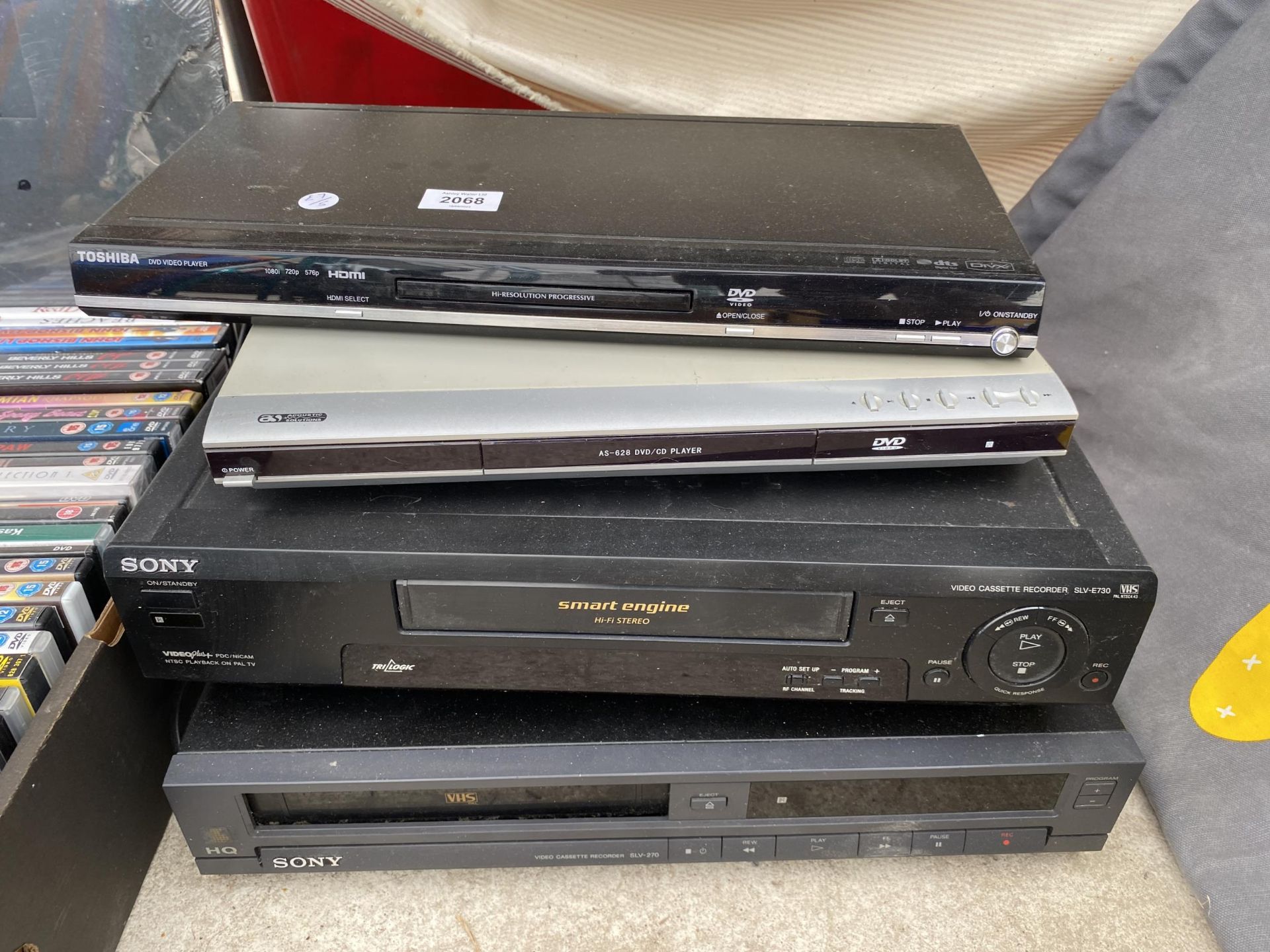 FOUR ELECTRICAL ITEMS TO INCLUDE TWO DVD PLAYERS, TWO VHS PLAYERS AND A COLLECTION OF DVDS - Image 2 of 2