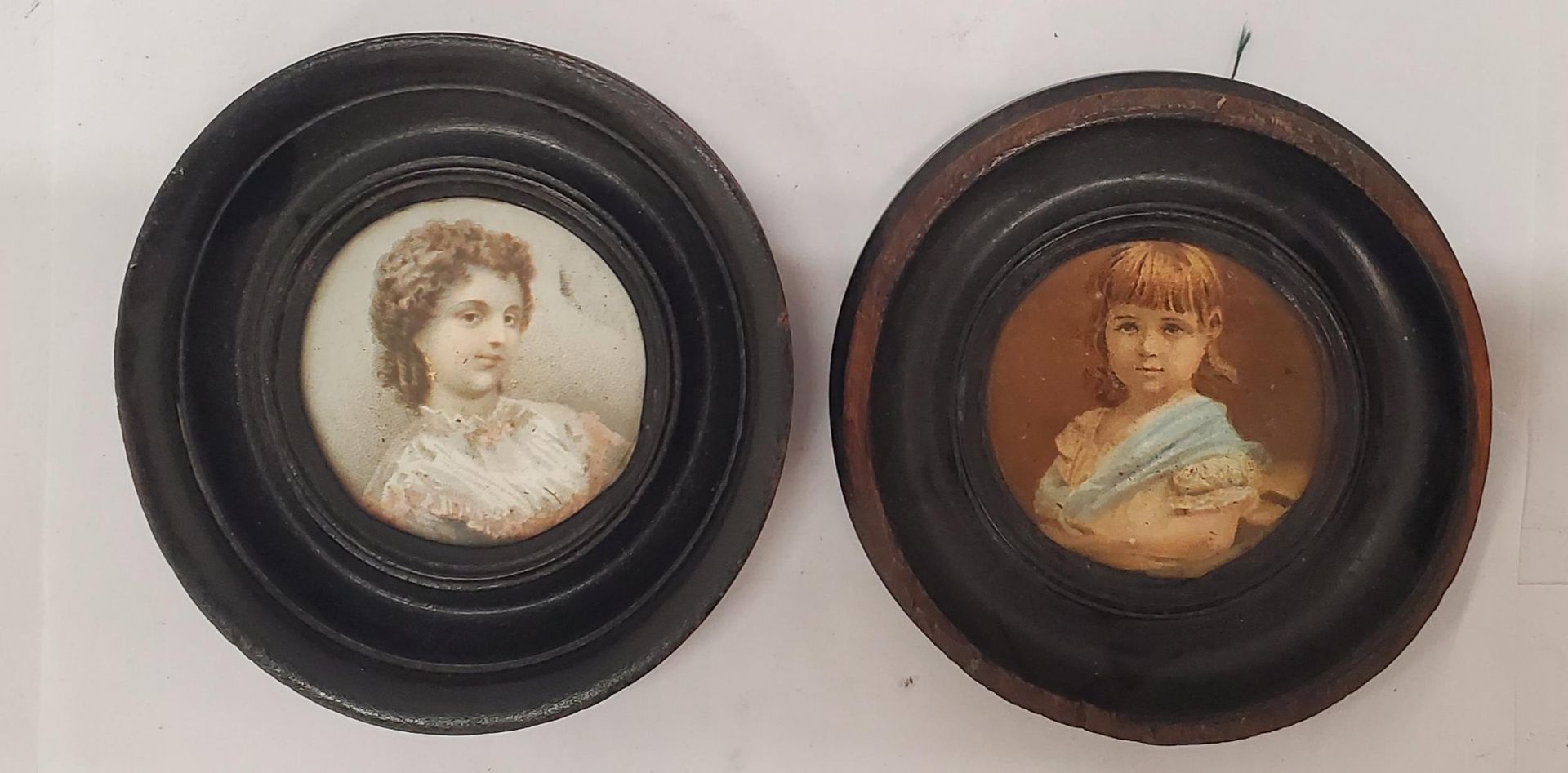 TWO VINTAGE MINIATURE PORTRAITS IN ROUND FRAMES