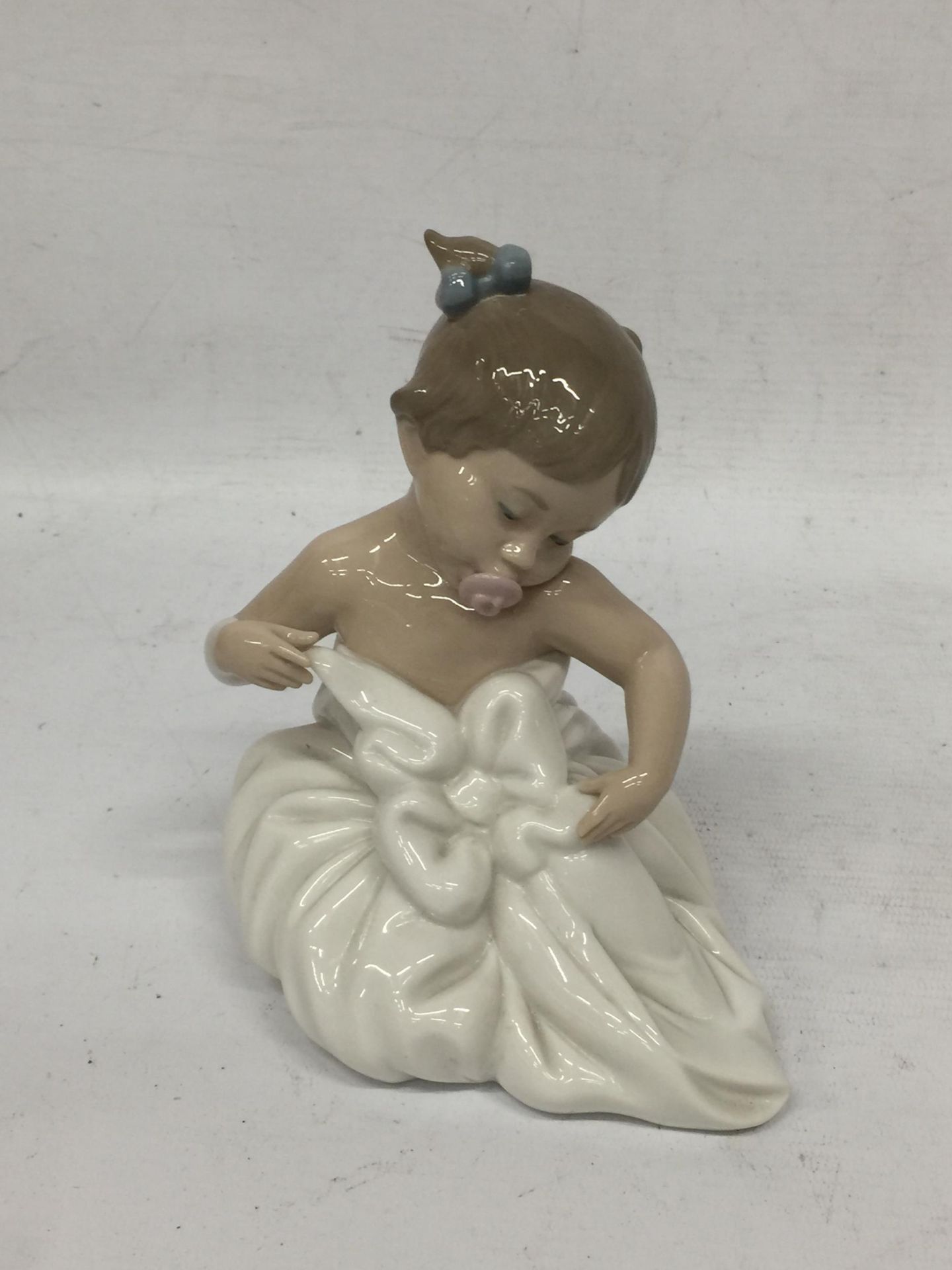 A NAO LLADRO BABY IN BLANKET AND DUMMY FIGURE