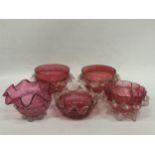 A GROUP OF FIVE VINTAGE CRANBERRY GLASS BOWLS