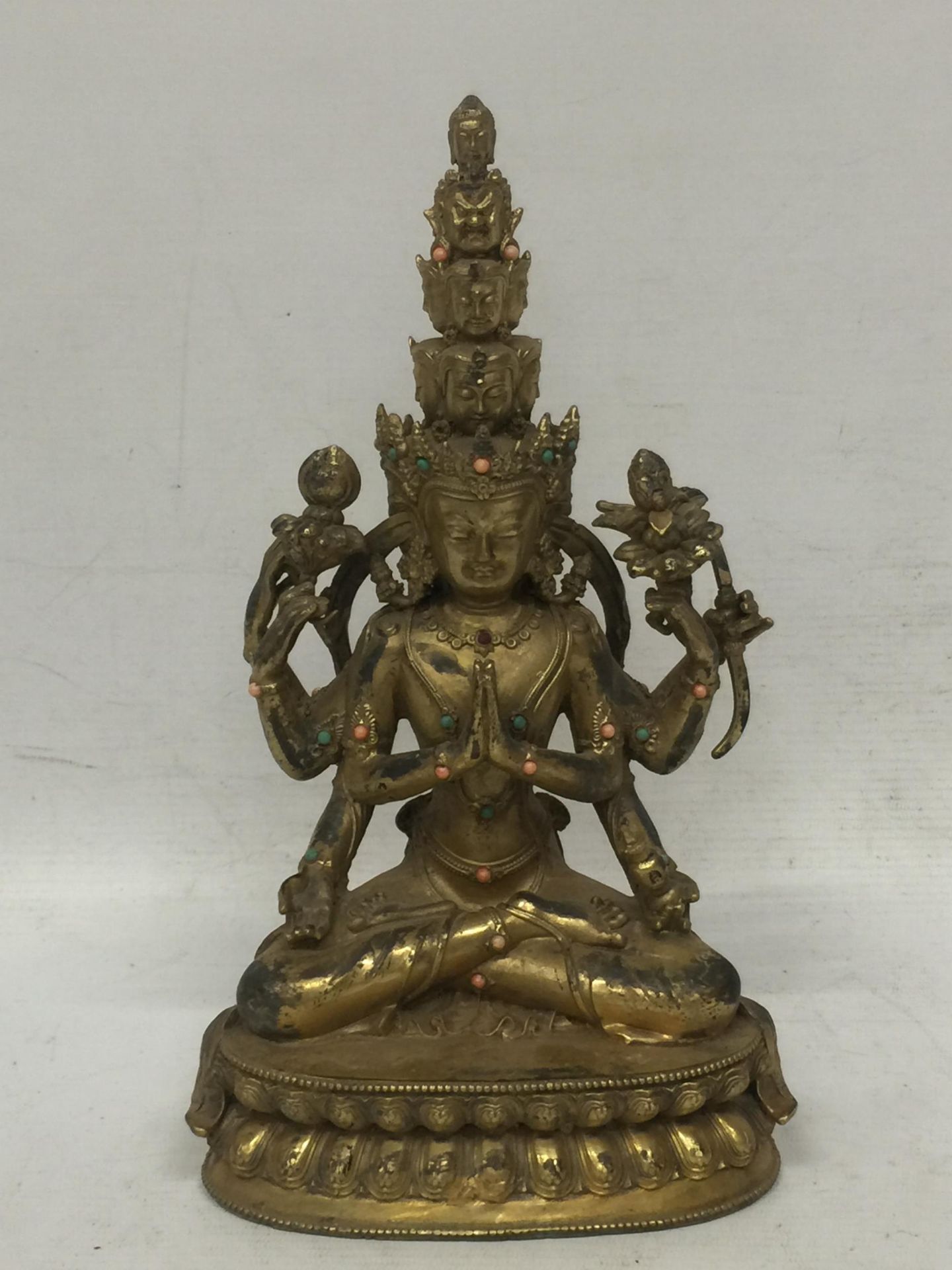 A GILT BRONZE REPOUSSE THRONE AND AUREOLE WITH BUDDHA