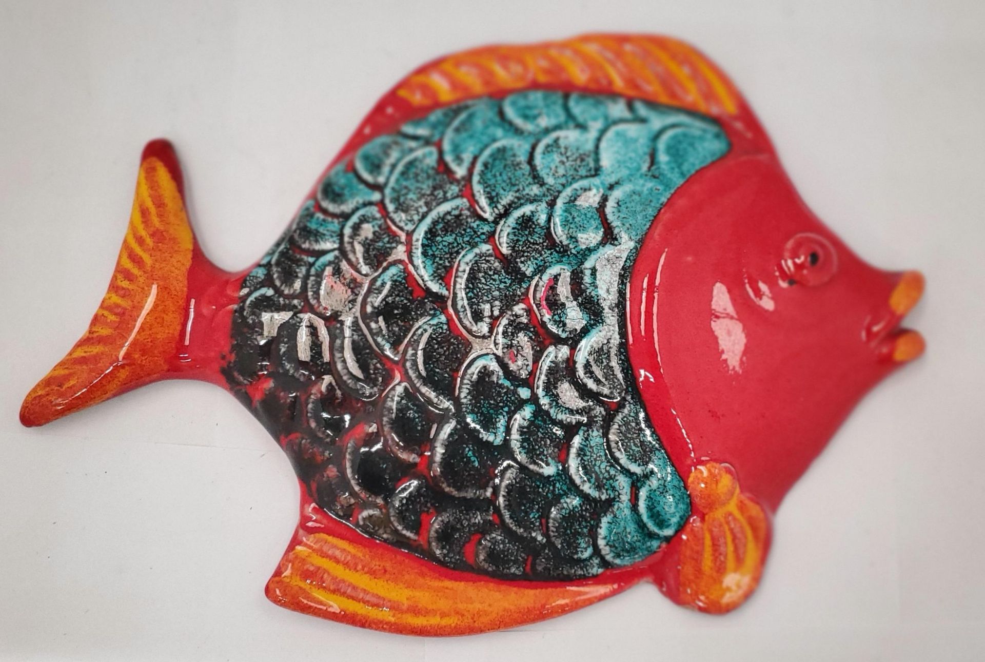 AN ITALIAN HAND PAINTED FISH WALL PLAQUE