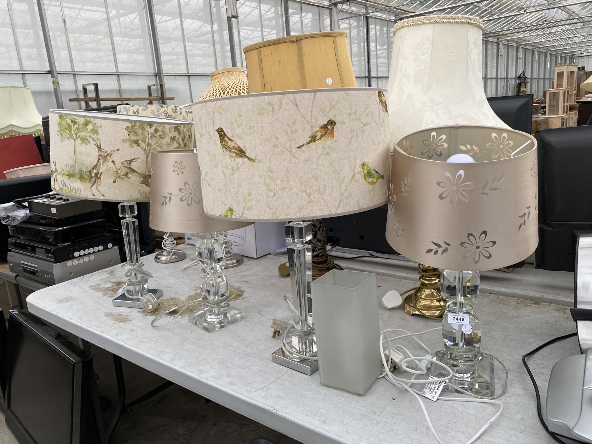 A COLLECTION OF TABLE LAMPS WITH DECORATIVE SHADES