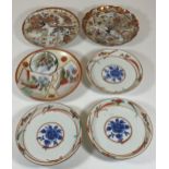 SIX JAPANESE PORCELAIN DISHES - SET OF THREE FLORAL EXAMPLES AND THREE KUTANI EXAMPLES, LARGEST