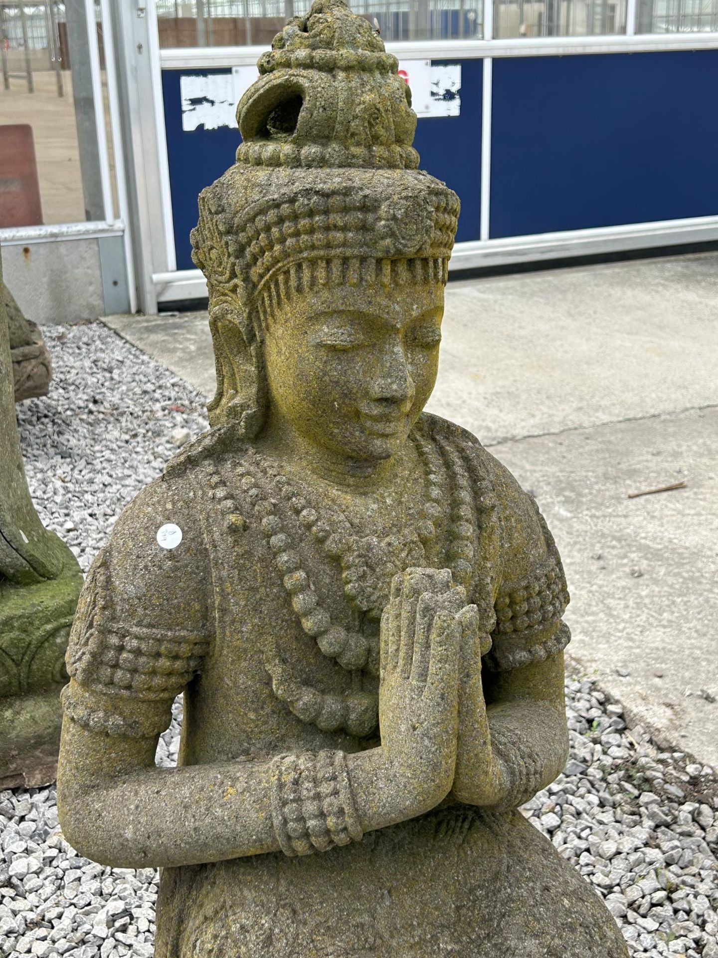 A LARGE RECONSTITUTED STONE BUDDHIST DIETY FIGURE - HEIGHT 108 CM, DEPTH 42 CM - Image 2 of 5