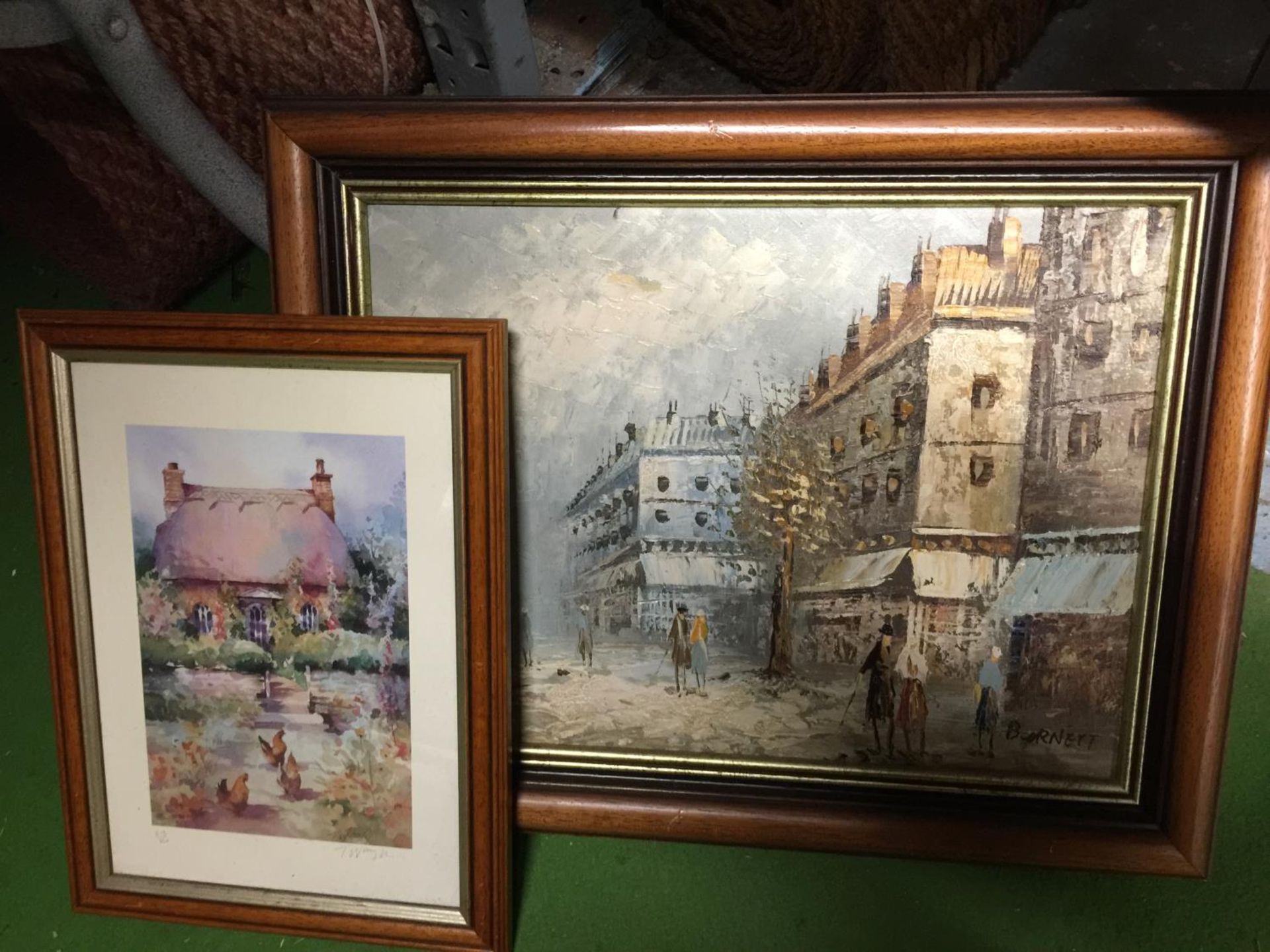 AN OIL ON CANVAS OF A STREET SCENE SIGNED BURNETT AND A LIMITED EDITION 213/350 PRINT OF A COTTAGE