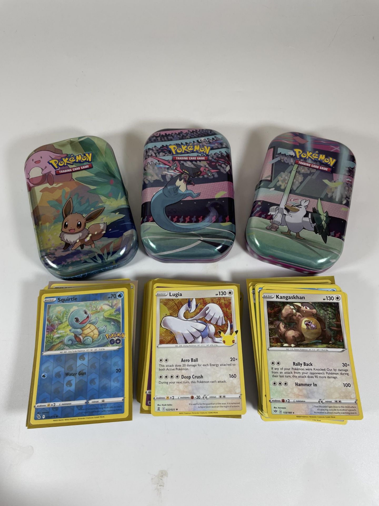 THREE TINS OF ASSORTED POKEMON CARDS, HOLOS SQUIRTLE, MOLTRES ETC - Image 3 of 4