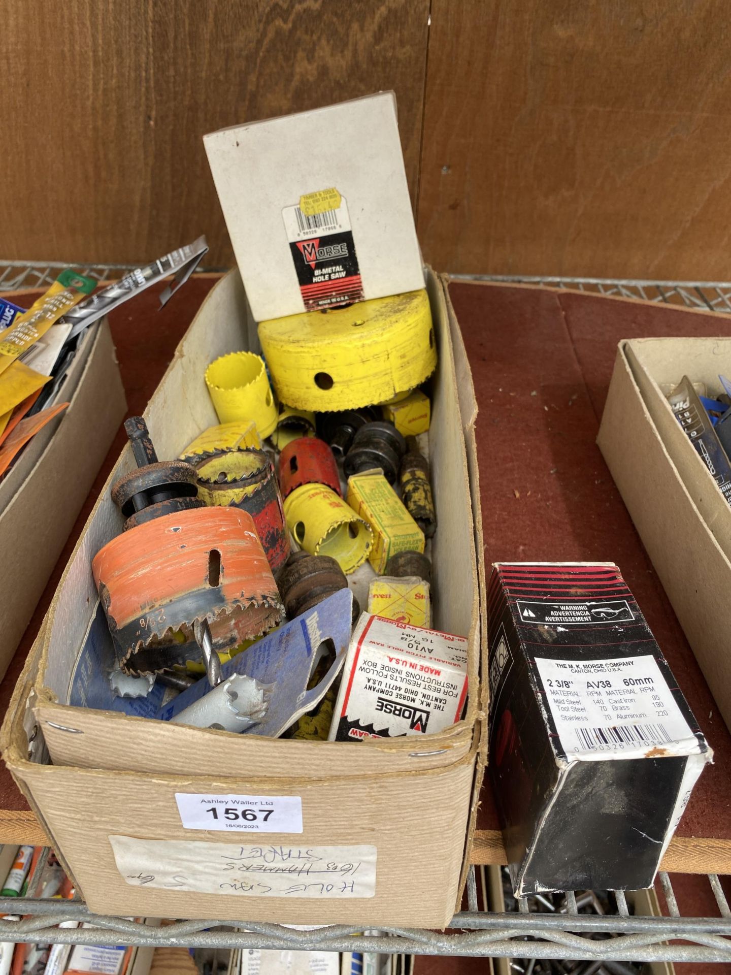 A BOX OF HOLE SAW TOOL ATTACHMENTS