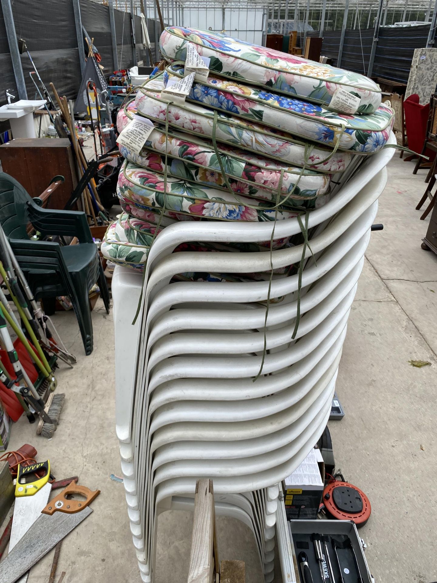 TWELVE WHITE PLASTIC STACKING CHAIRS AND CUSHIONS - Image 2 of 2