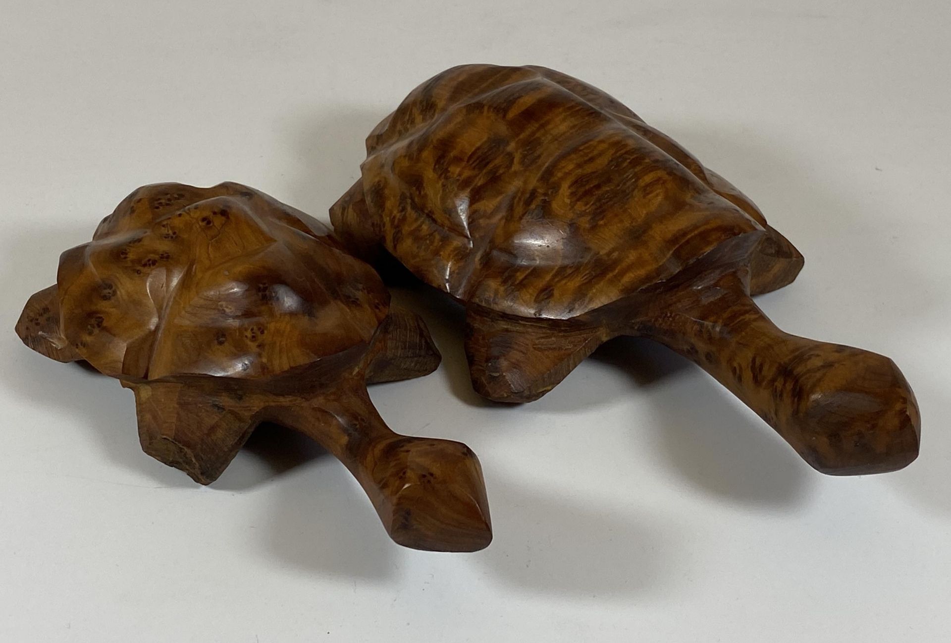 A PAIR OF WALNUT EFFECT WOODEN TURTLES, LENGTH 18CM