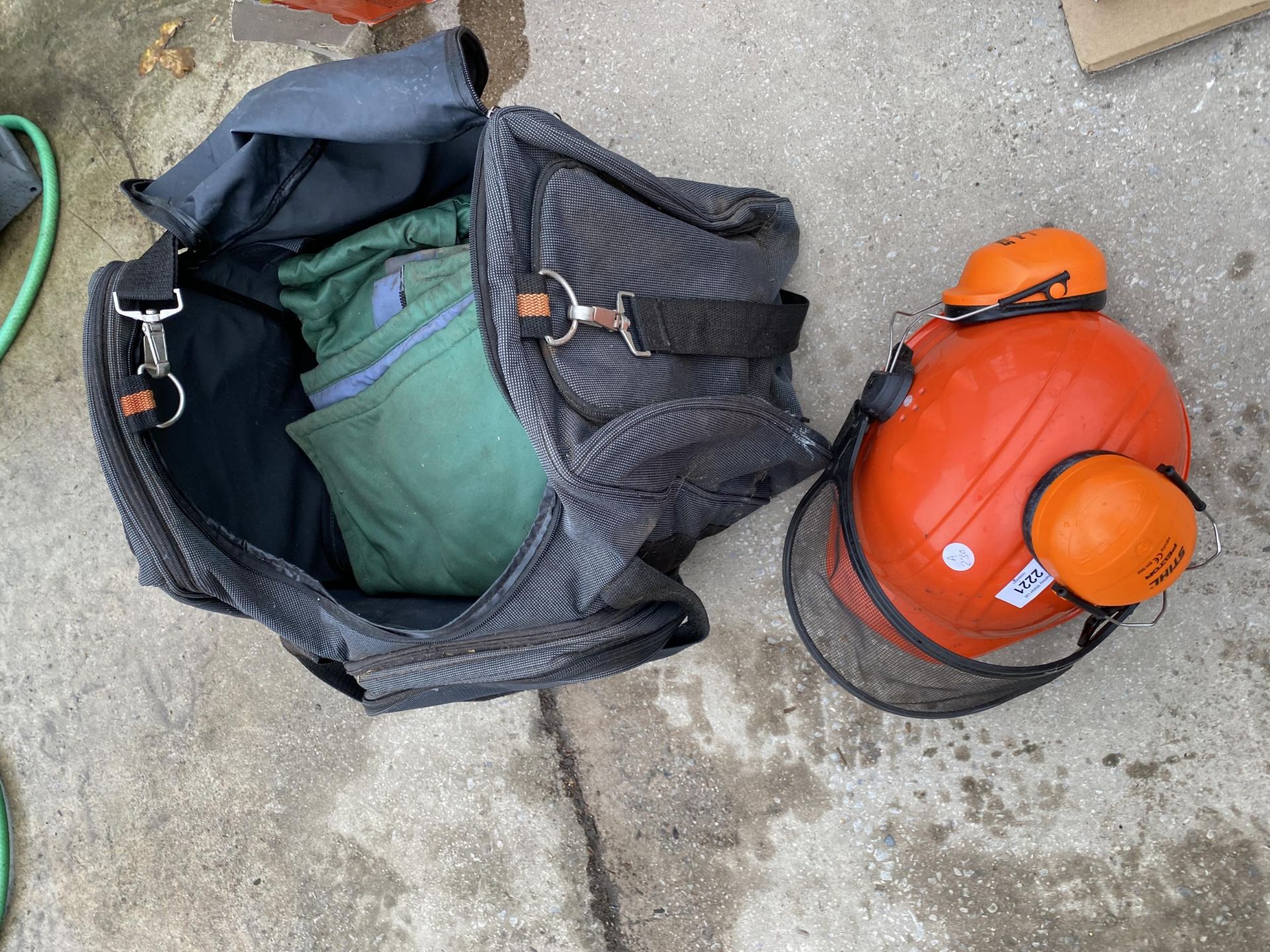 A COLLECTION OF STIHL SAFETY EQUIPMENT TO INCLUDE HELMET, OVERALLS, ETC