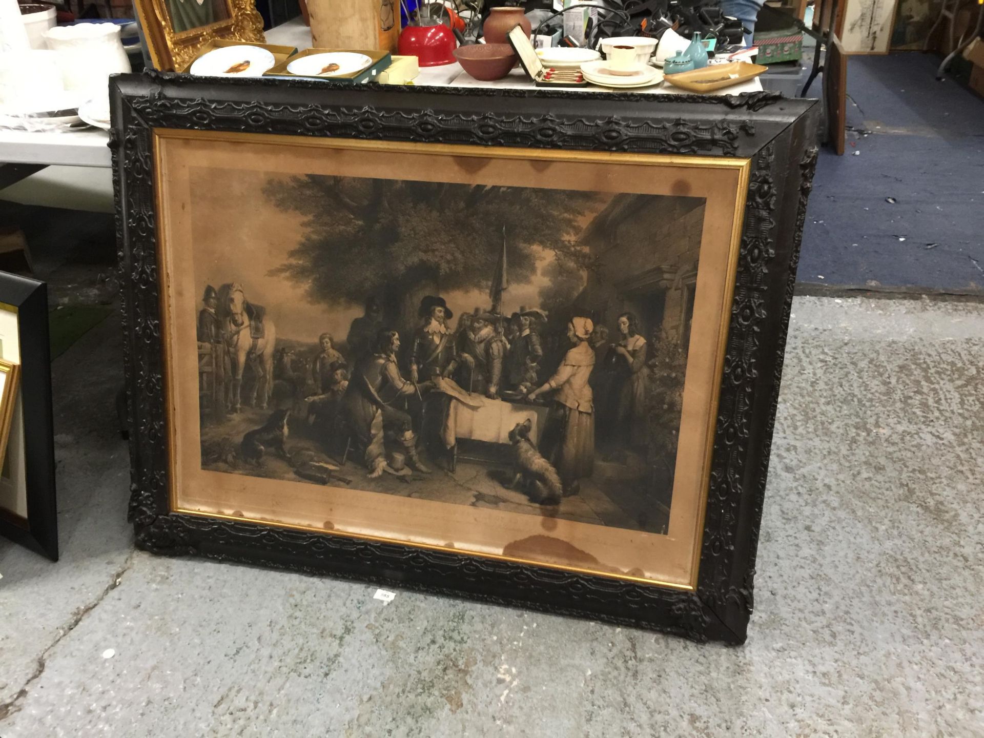 A LARGE VINTAGE BLACK ORNATE FRAMED ENGRAVING