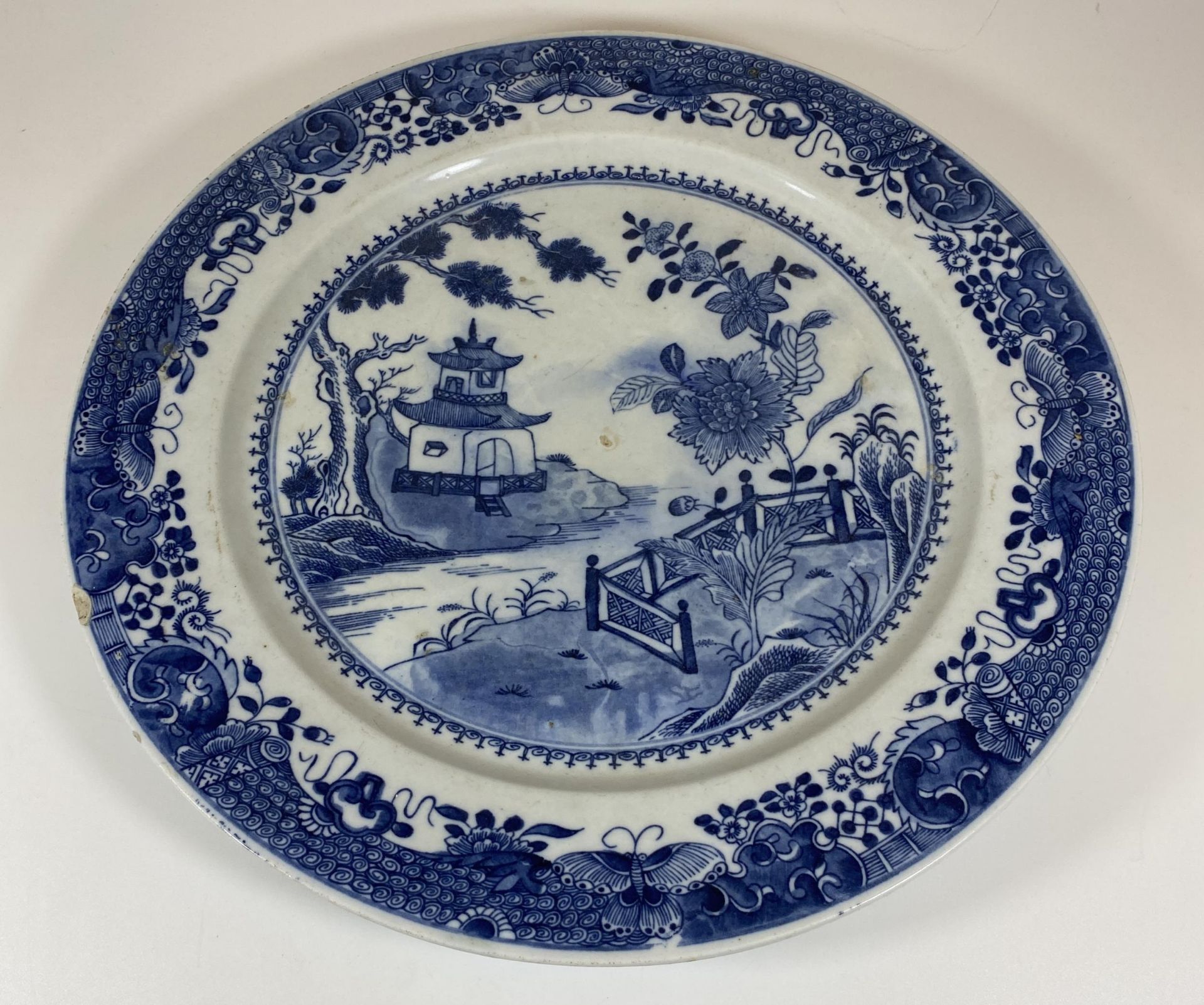 A LARGE CHINESE EARTHENWARE POTTERY BLUE AND WHITE CHARGER WITH PAGODA LANDSCAPE DESIGN, DIAMETER