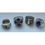 FOUR SILVER DRESS RINGS GROSS WEIGHT 24.40 GRAMS