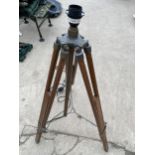 A VINTAGE WOODEN STANDARD TRIPOD LAMP