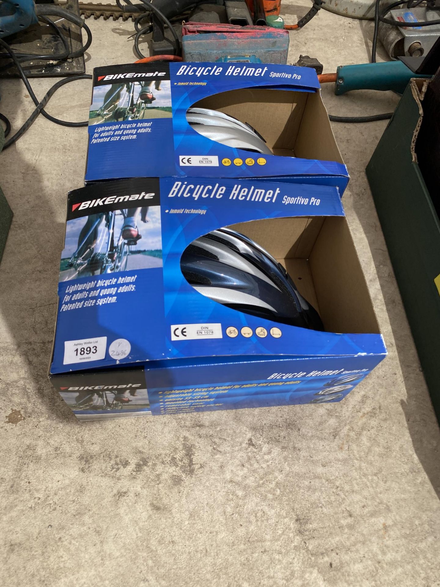 TWO BOXED BICYCLE HELMETS