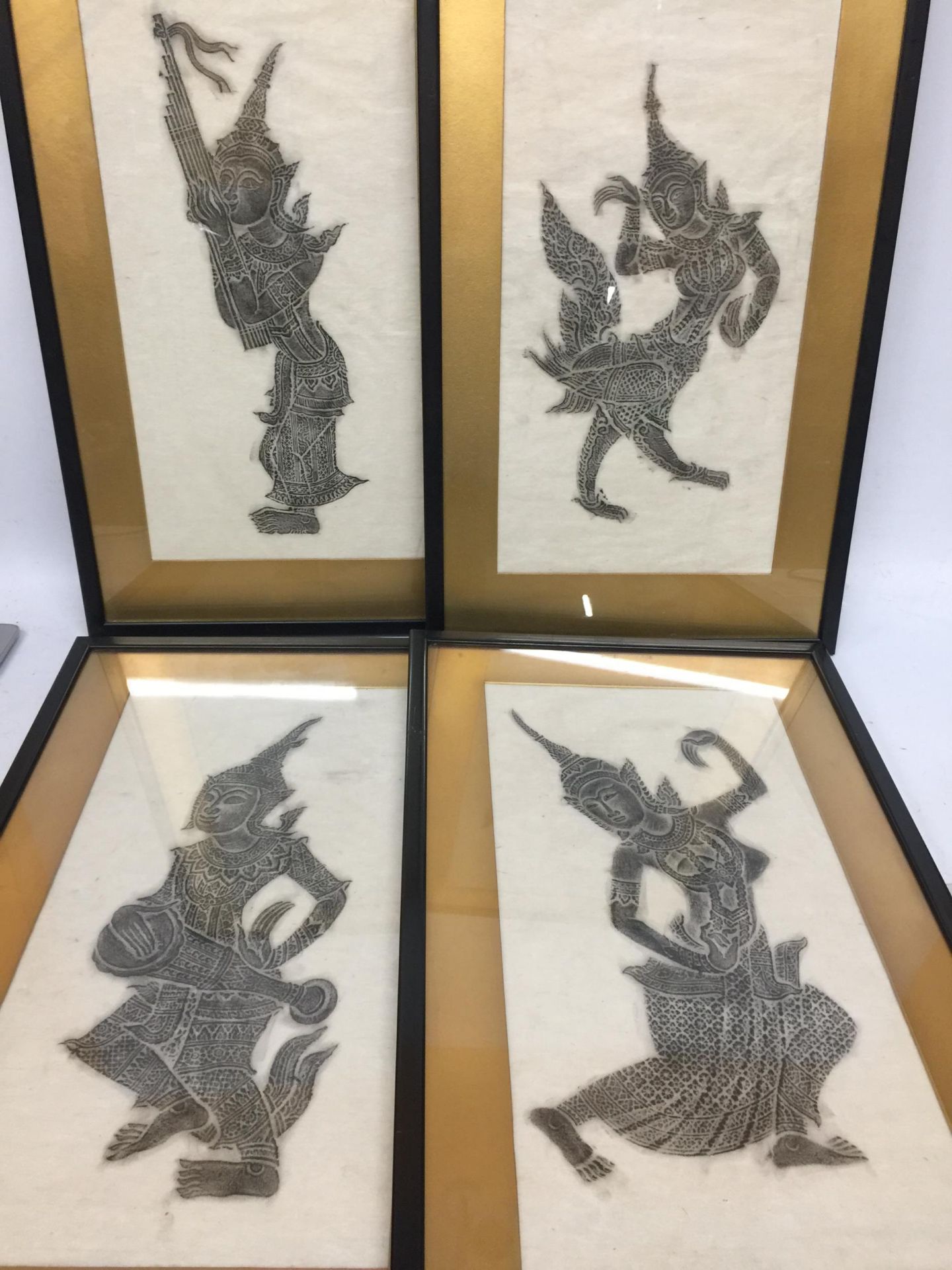 A SET OF FOUR FRAMED ORIENTAL DANCING LADY PICTURES